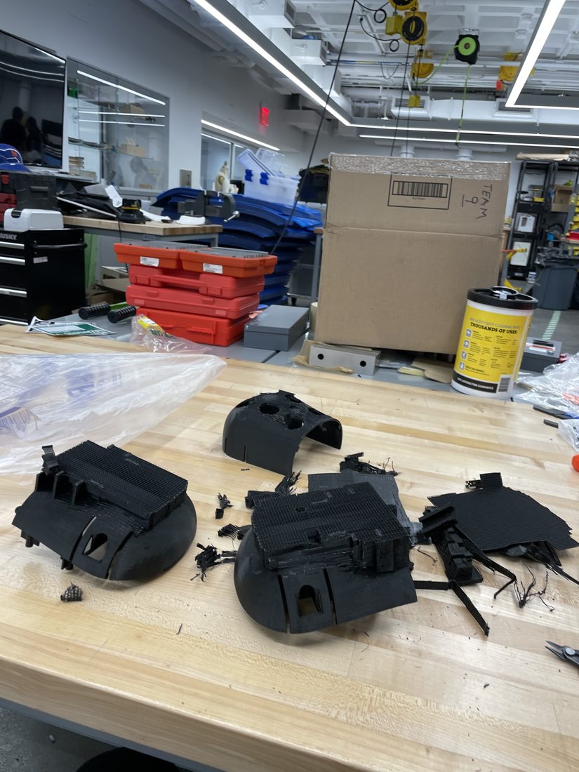 3D-printed chassis and parts on the workbench